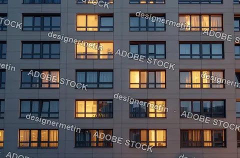 Modern Residential Apartment Building Facade With Illuminated Windows At Evening Twilight Urban Cityscape View