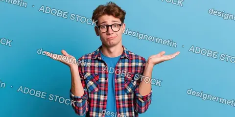 Puzzled Young Man Shrugging Shoulders On Blue Background