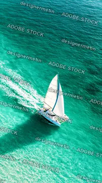 Catamaran Cruising Turquoise Ocean Aerial View