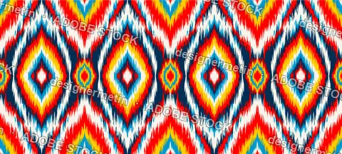 Vibrant Seamless Ikat Pattern Featuring Colorful Geometric Diamond Shapes With Jagged Edges For Textile And Ethnic Fashion Fabric.