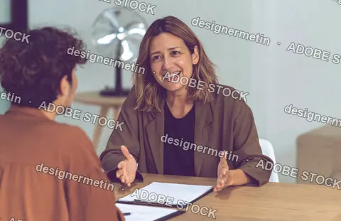 Friendly Therapist Talking With Client During Mental Health Counseling Session