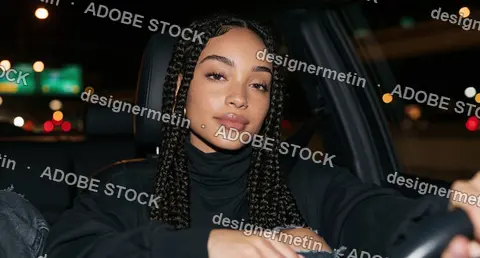 Young Woman With Long Braids Driving Car At Night, Confident Urban Portrait