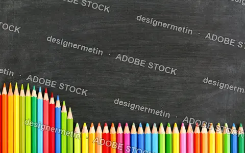 Colorful Pencils Framing Blank Chalkboard Background With Large Copy Space